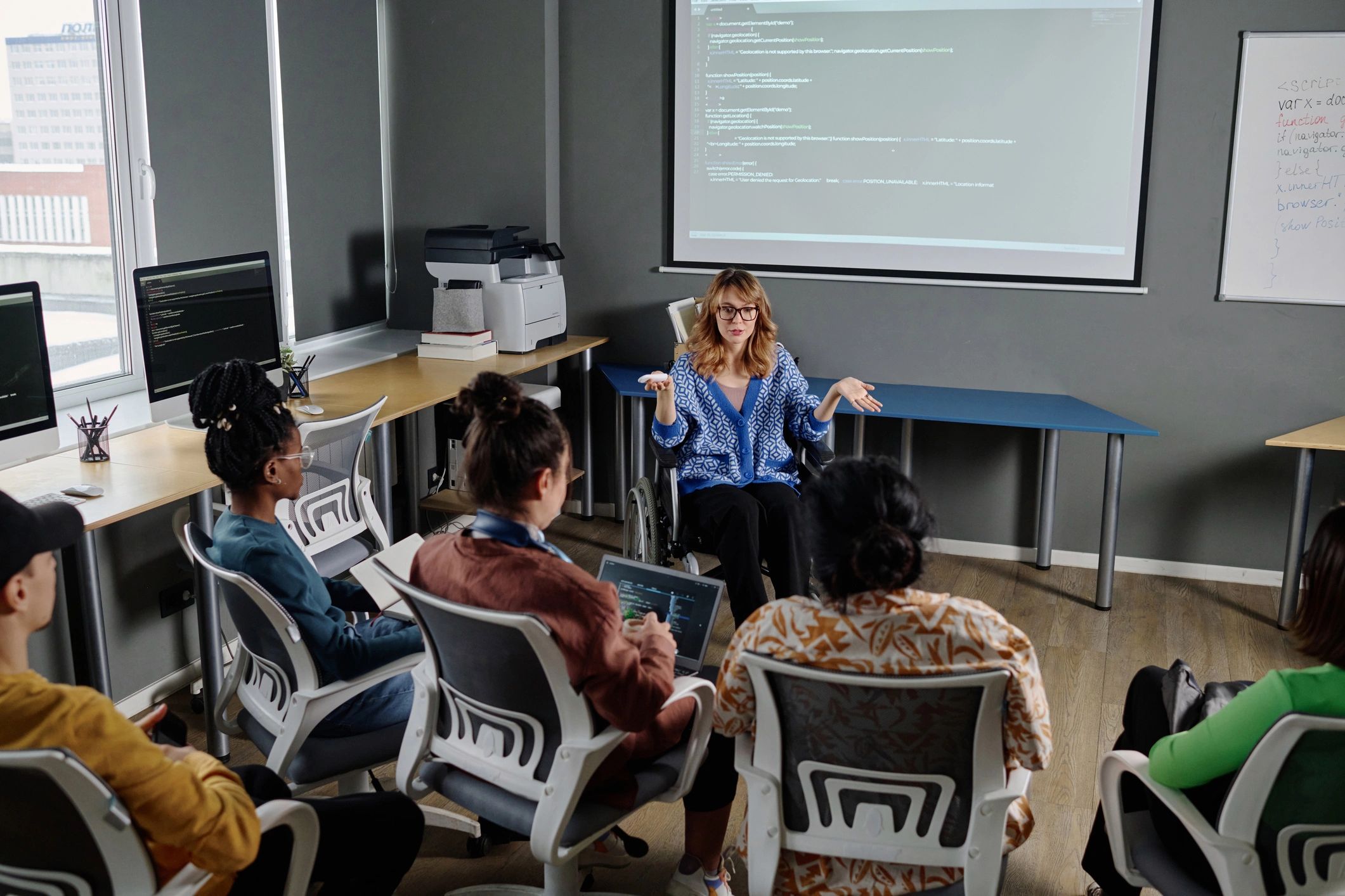 Speaker leading an educational session with colleagues